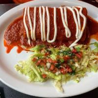 Wet Burrito · Beans, rice & your choice of meat, topped with homemade red enchilada sauce, sour cream, a s...