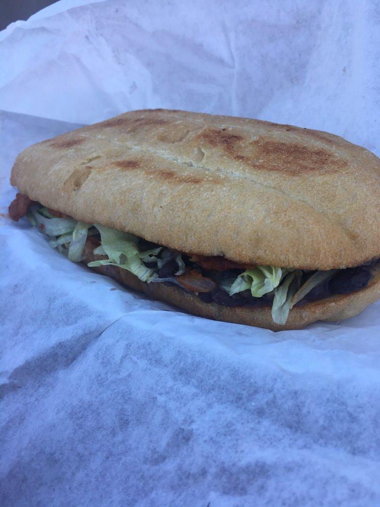 Torta · Mexican sandwich your choice of meat, butter, beans, mayonnaise, jalapenos, grilled onions, lettuce.
