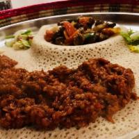 Yemisir Wot · Zesty lentil splits slowly cooked in a flavorful berbere sauce with red onions and a blend o...