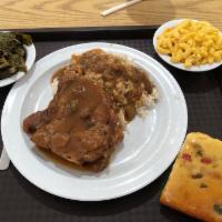 Smothered Pork Chops · 3 side items included.