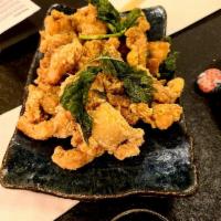 Taiwan Style Fried Salty Chicken · Deep fried diced chicken mixed with fresh basil.