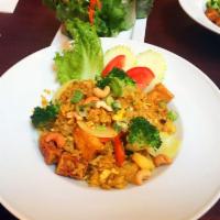 Pineapple Fried Rice · Fried rice with egg, pineapple, tomato, onion, cashew nut and curry powder.