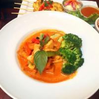 Red Curry · Sweet basil, bell pepper, eggplant, bamboo shoots and mixed vegetable simmered in coconut mi...