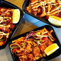 Fish and Shrimp Combo Meal · Includes 2 sides.