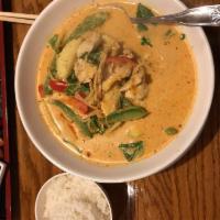 Red Curry · Thai curry with red curry paste, coconut milk, bamboo shoots, bell peppers, zucchini and bas...