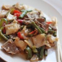 Drunken Noodle · sauteed with bell peppers, bamboo shoots, green beans and basil leaves in a spicy basil sauce.