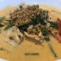 Panang Curry · Panang curry paste with coconut milk, bell peppers, green beans and ground peanuts. Served w...
