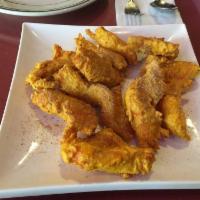 Chicken Pakora · Deep-fried chicken breast fritters in spiced gram flour.