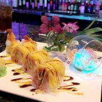 J15 Sunshine Roll · Uncooked inside: shrimp tempura and avocado topped with spicy tuna and mango in green soy pa...