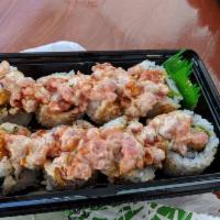 Dragon Maki · 8 pieces. Shrimp tempura, lettuce, teriyaki sauce, sesame seeds, ground ahi, green onion. to...