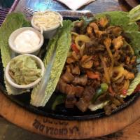 Fajitas · Served with rice and beans with pork.