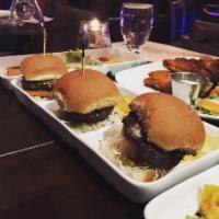 Chimmi Sliders · Marinated ground beef with red onions, manchego cheese, and topped with signature chime sauce.