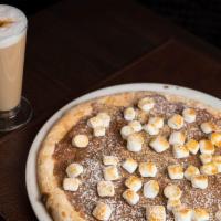 Nutella Pizza · Pizza, topped with nutella and powdered sugar.