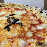 Margherita Pizza · Tomato sauce, fresh mozzarella cheese, basil and EVOO.