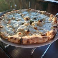 Quattro Formaggi Pizza · Imported Buffalo mozzarella, Parmigiano Reggiano, Gorgonzola, stracchino, basil and EVOO.