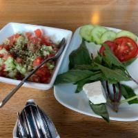 Shirazi Salad · Finely diced tomatoes, cucumbers and onions and lime dressing.