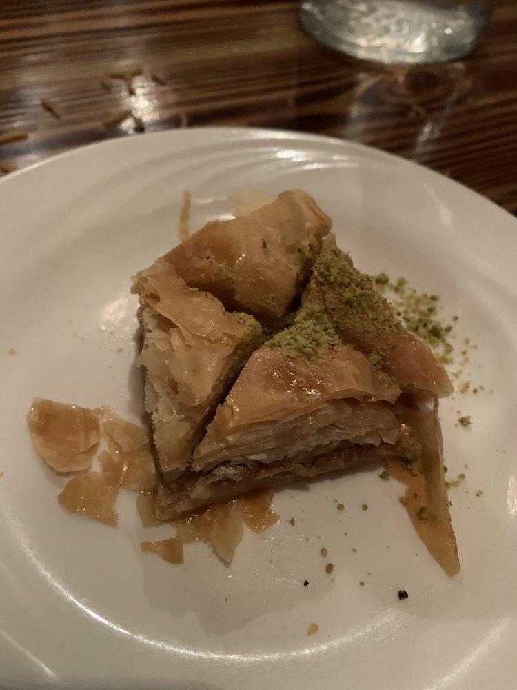 Baklava · Homemade sweet slice with almonds and pistachio nuts.