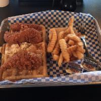 Hot Chicken and Waffles Plate · Includes a Belgian waffle 3 jumbo chicken tenders, syrup, butter and a choice of a side.