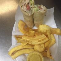 Cuban Chicken Wrap · Grilled chicken, black bean puree, maduros, lettuce, tomatoes and onion in special cilantro ...
