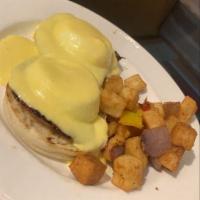 Traditional Eggs Benedict · 2 pan poached eggs on a toasted English muffin, black forest ham, shaved asparagus, hollanda...