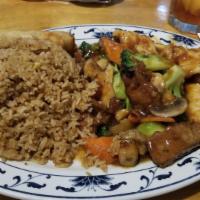 Triple Delight · Marinated beef, shrimp, chicken, sauteed with fresh mushrooms and vegetables in a special ho...