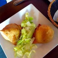 Vegetable Samosa · Delicately spiced potatoes & pes wrapped in crispy pastry. 