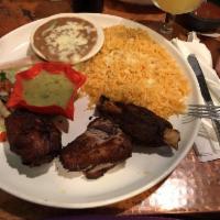 Pork Carnitas · Grilled and deep-fried pork so tender it peels right off the bone. Seasoned with Mexican spi...