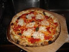 Margherita Pizza · Fresh basil, garlic, fresh tomatoes and mozzarella cheese. 