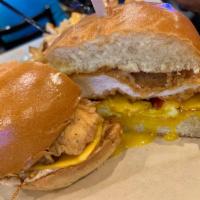 Dirty Bird Sandwich · Crispy chicken breast, Flippin’ sauce, American cheese, smoked bacon, and a fried egg. Serve...