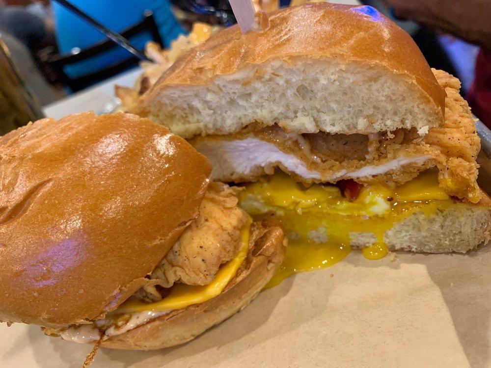 Dirty Bird Sandwich · Crispy chicken breast, Flippin’ sauce, American cheese, smoked bacon, and a fried egg. Served with French Fries. Upgrade to Specialty fries or house salad.