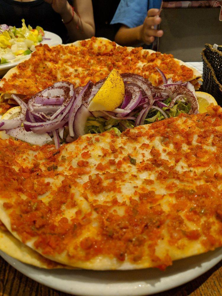 Lahmacun · Round, thin pieces of dough topped with minced lamb and beef.