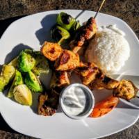 Chicken Shish Plate · Souvlaki. Marinated chunks of grilled chicken served with steamed veggies and rice.