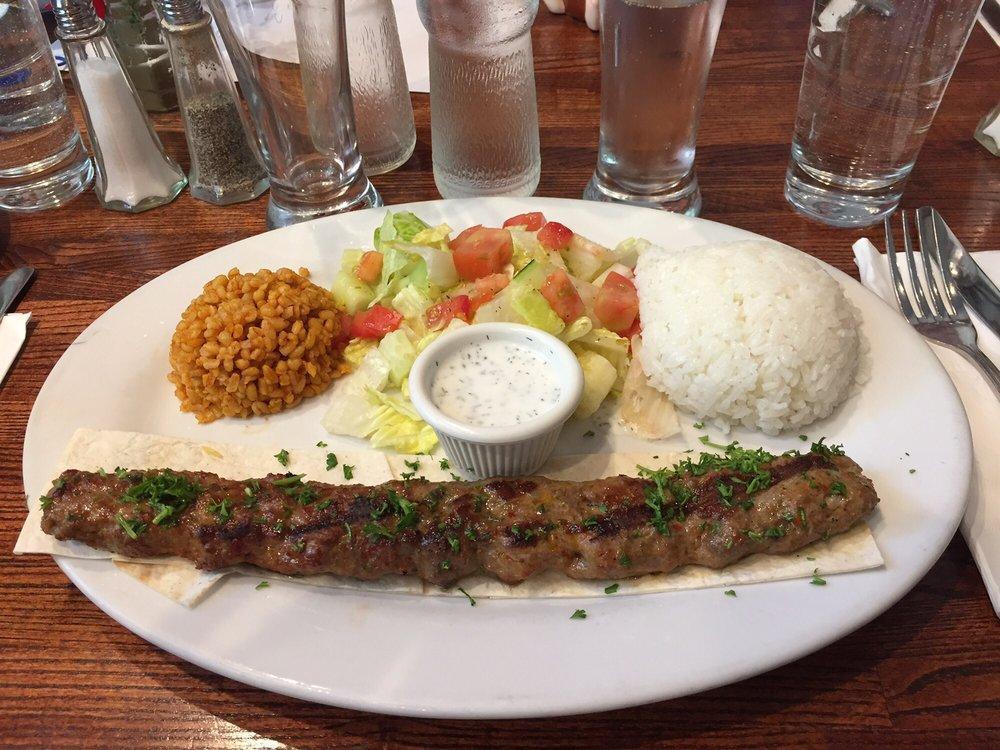 Adana Kebab · Koobideh. Grilled and skewered minced lamb, flavored with herbs and served with salad and rice.