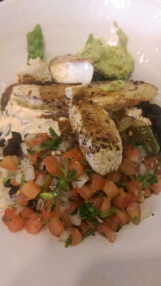 California Bowl · Made with citrus rice, black beans, and fresh romaine lettuce topped with handmade guacamole, salsa fresca, chipotle sauce, and your choice of roasted chipotle salsa or salsa verde. Served with your choice of grilled seafood, grilled all-natural chicken or steak, or grilled veggies.