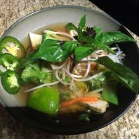 Vegan Pho · Vegan broth noodle soup with sliced fried tofu, broccoli, snow peas, bok choy, mushroom, & c...