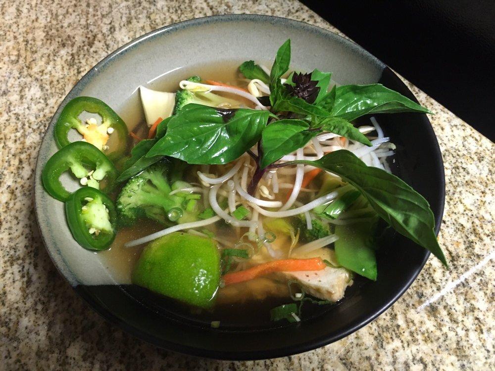 Vegan Pho · Vegan broth noodle soup with sliced fried tofu, broccoli, snow peas, bok choy, mushroom, & carrot.