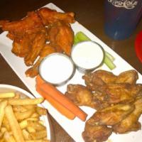 Boneless Buffalo Wings · Chicken fingers freshly breaded to order and tossed in your choice of sauce. Accompanied wit...