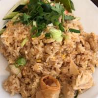 Thai Fried Rice · Stir fried white rice with egg, onion, scallion, tomato and soy sauce. 
