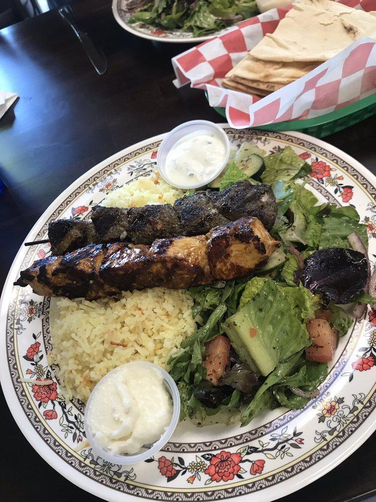 Combo Plate · Choice of any 2 meats or falafel served with rice pilaf, salad, and tzatziki. Served with pita bread.