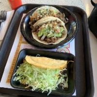 Carnitas Taco · Grilled pork, guacamole, and pico de gallo.