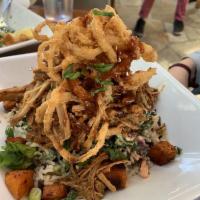 Pulled Pork Bowl · Brown Rice, Kale, Pecan, Sweet Potatoes, Crispy Onions, Scallions and BBQ sauce.
