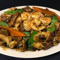 Triple Crown · Combination of large shrimp, white meat chicken and sliced flank steak, sauteed with fresh s...