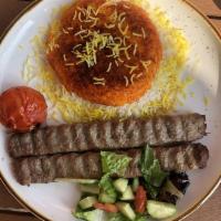 Koobideh · 2 skewers of seasoned mixed ground beef and lamb with grilled tomato served with tahdig rice.