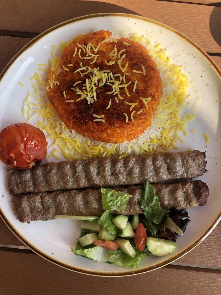 Koobideh · 2 skewers of seasoned mixed ground beef and lamb with grilled tomato served with tahdig rice.