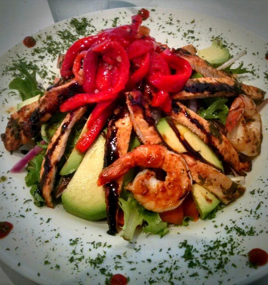 Crazy Jorgio's Salad · It's amazing! Mixed greens, fresh tomatoes, red onions, avocado, grilled chicken, grilled shrimp, and special house dressing.