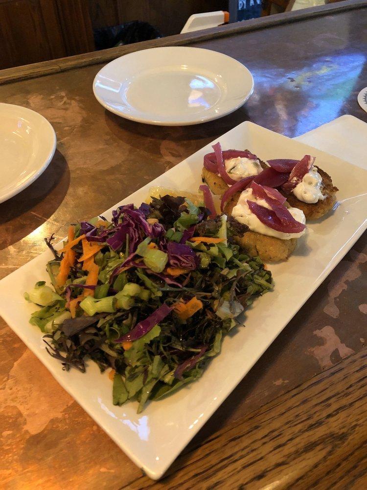 Heart Cakes · Savory pan fried cakes of chickpeas, hearts of palm and artichoke, topped with pickled red onion, vegan tartar sauce and a small organic salad.  Like crab cakes (without the crab). Vegan.