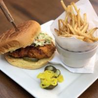 Nashville Hot Chicken Sandwich · Tender, spicy marinated chicken, battered and deep fried, tossed with firkin hot sauce on a ...
