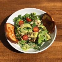 The Green Queen Salad · A blend of crisp kale and romaine, topped with chopped avocado, toasted almonds, pepitas and...