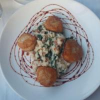 Scallops · Pan seared diver scallops served with a bacon spinach risotto and finished with a port wine ...