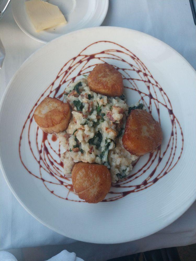 Scallops · Pan seared diver scallops served with a bacon spinach risotto and finished with a port wine reduction.